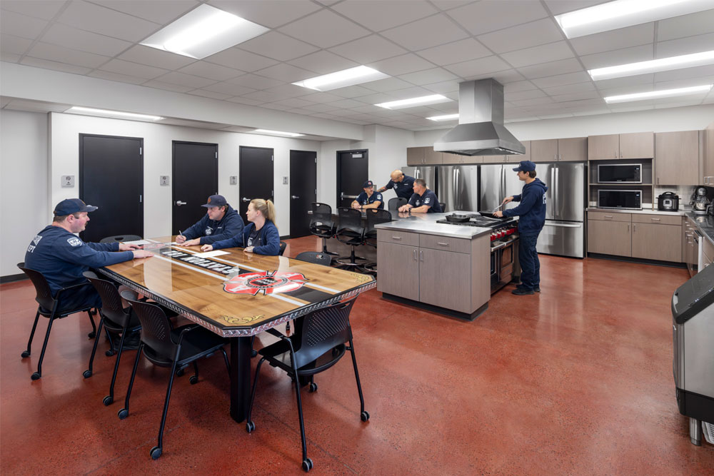 Firefighters spending time in fire station kitchen